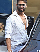 Shahid Kapoor in a white open-button shirt and distressed jeans.jpg